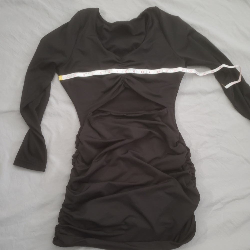 Long sleeve spandex body con dress.  Very flattering hides imperfections